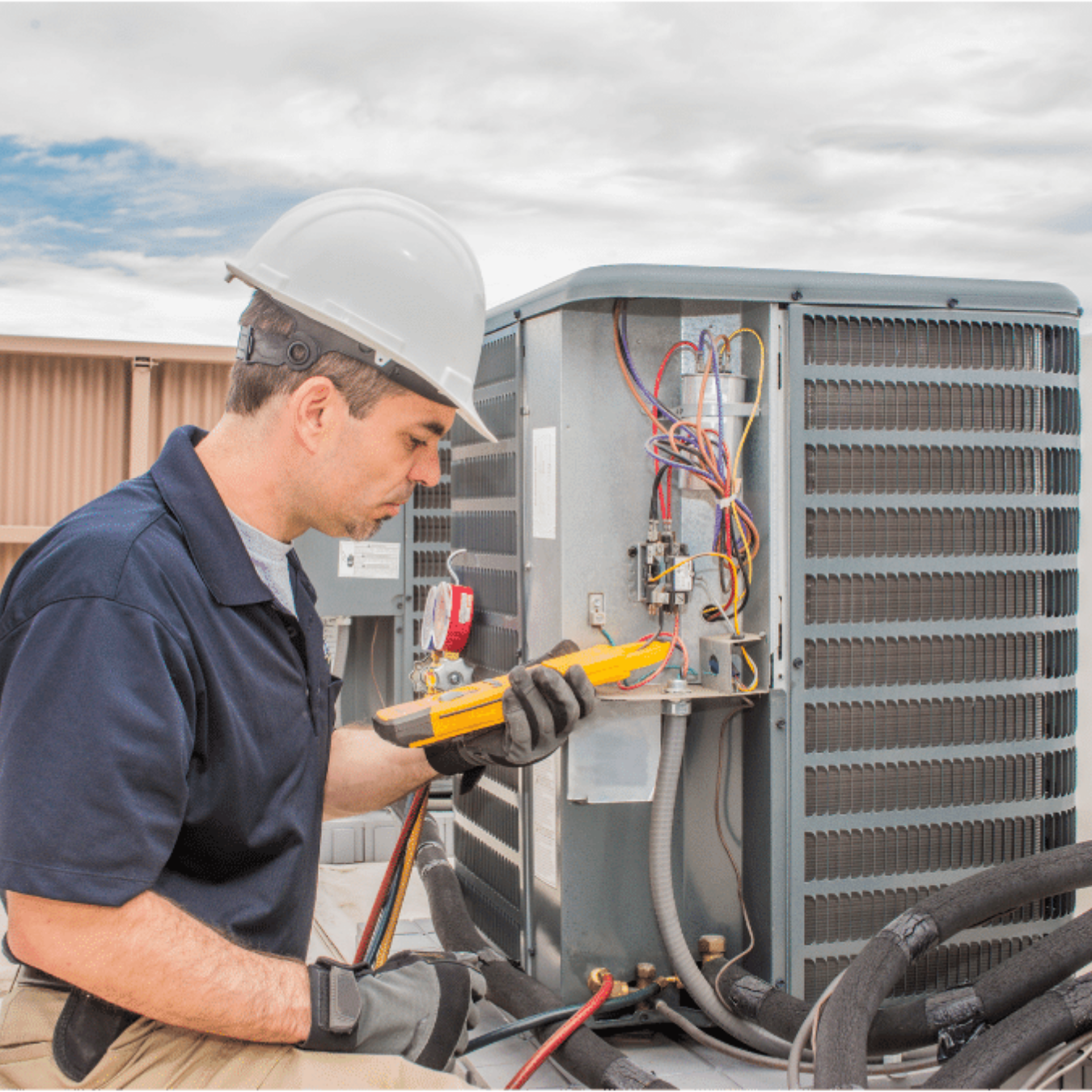 Guelph HVAC Pro HVAC technician servicing a system