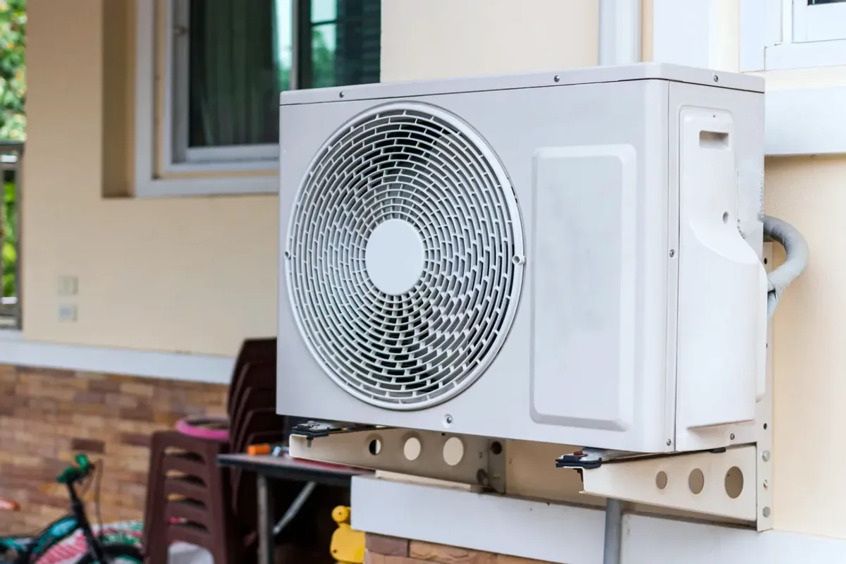 Outdoor heat pump unit on a wall bracket